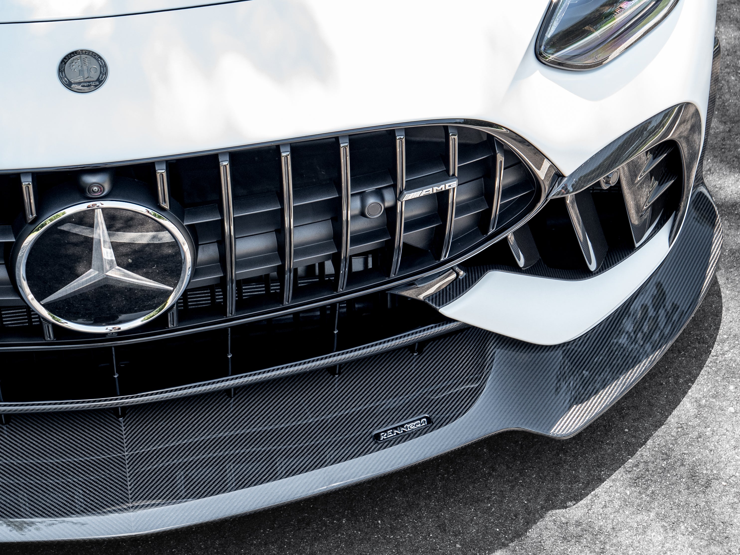 Close detail of the fitted RennTech splitter beneath the AMG Panamericana grille