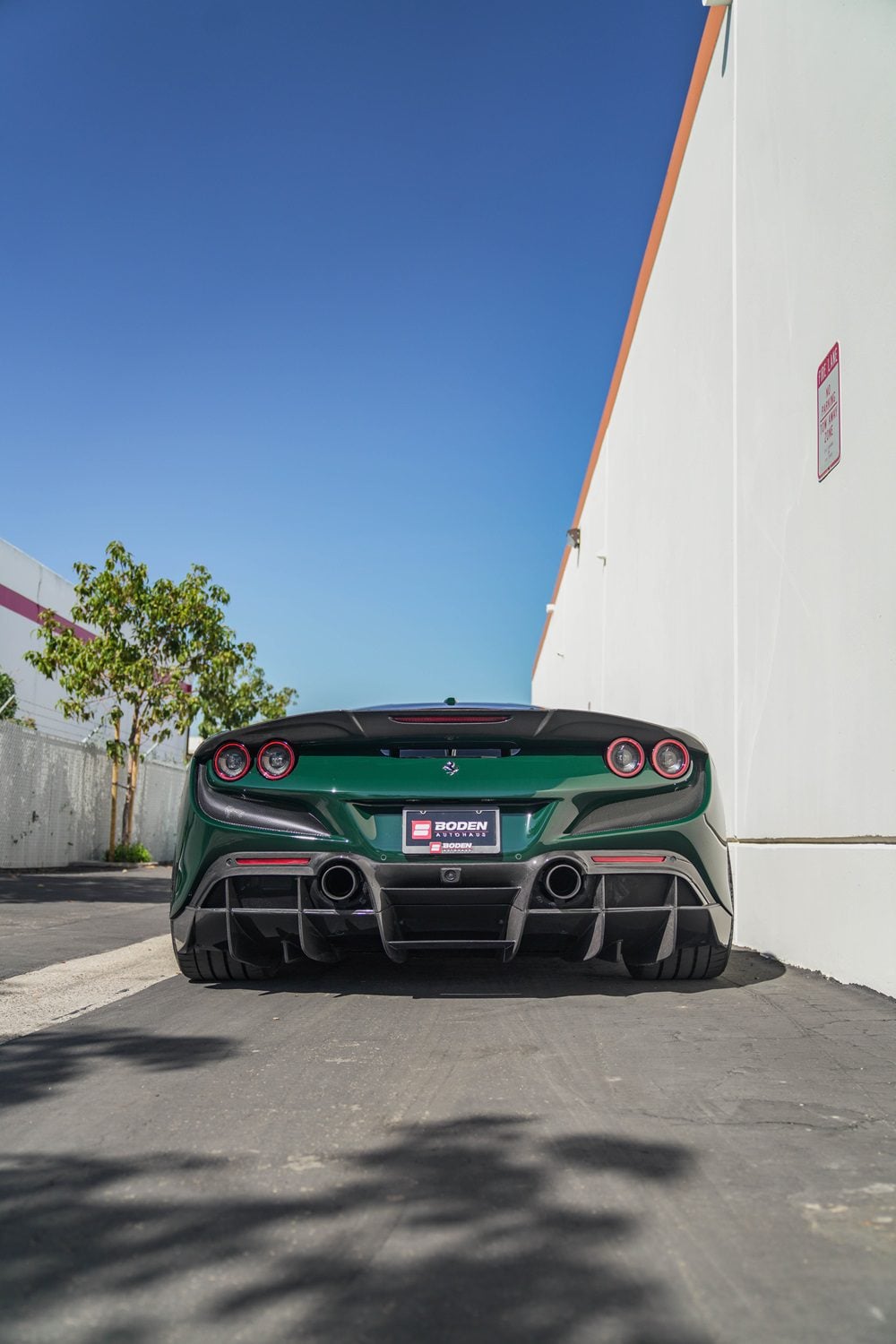 Green Ferrari F8 Tributo rear view with the complete aero kit