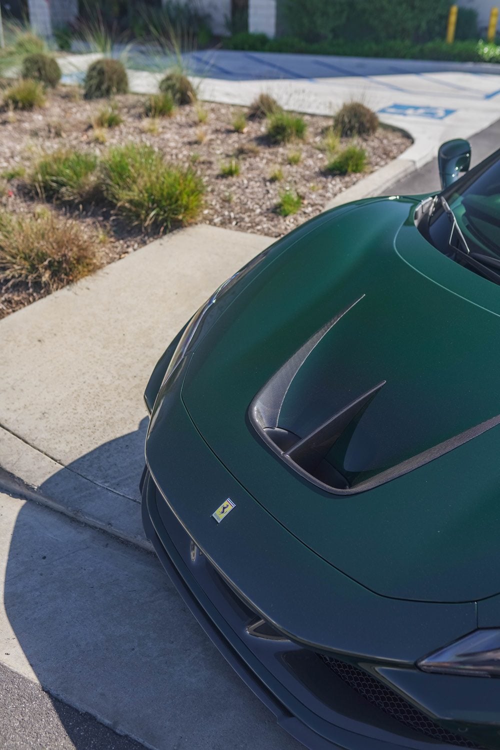Carbon hood vents on a green Ferrari F8 Tributo