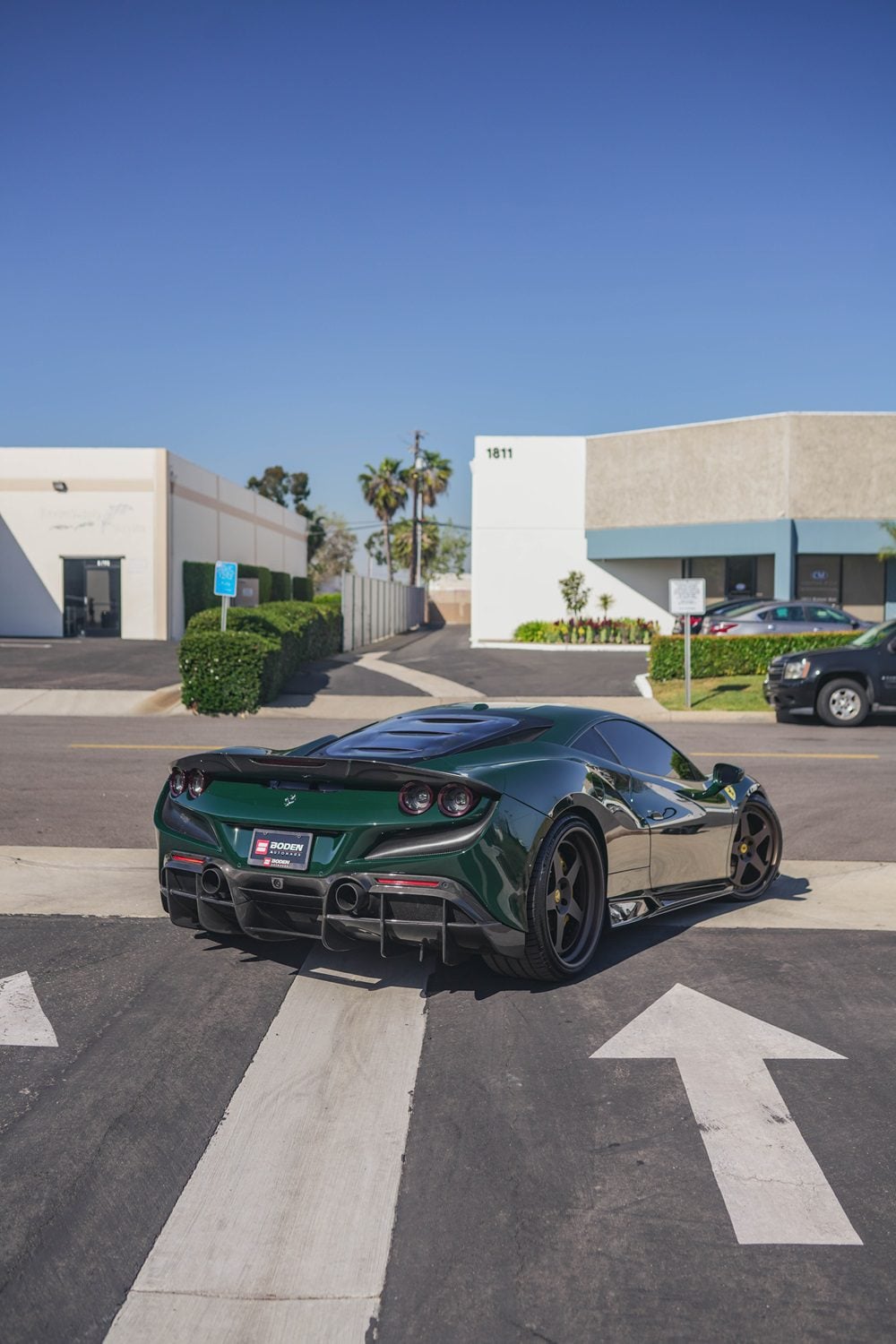 Green Ferrari F8 Tributo rear three-quarter with the complete aero kit