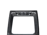 A close up view of AUTOTECKNIC CARBON FIBER CENTER CONSOLE - BMW F97 X3M | F98 X4M LCI 2021+ with white background
