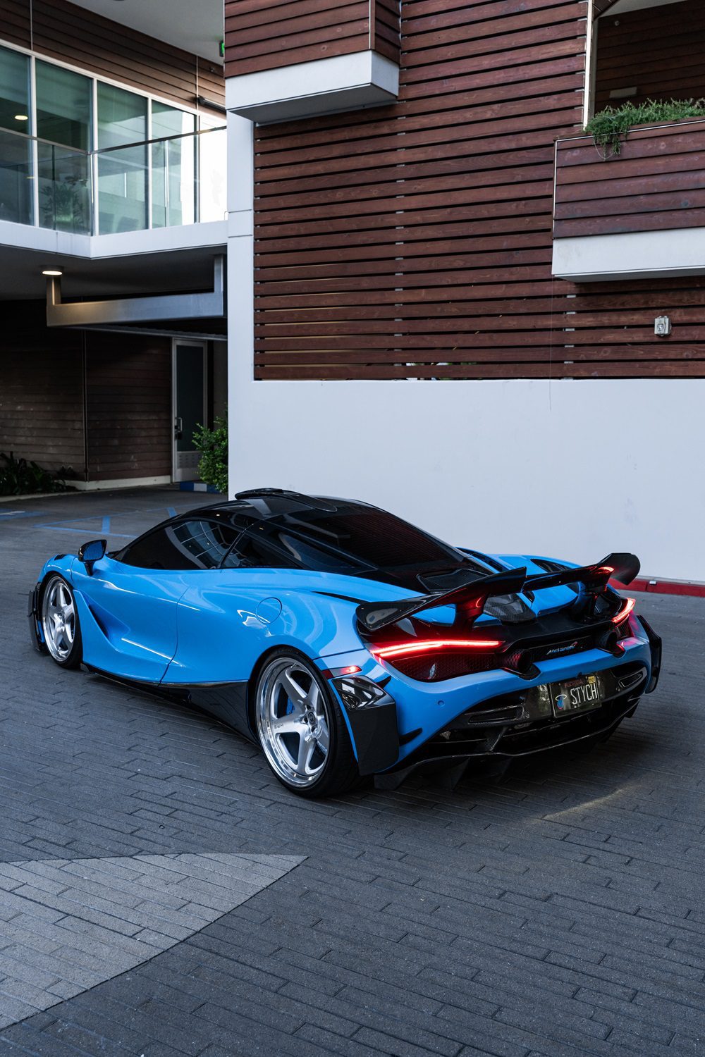 Blue McLaren 720S rear three-quarter with the V2 complete aero kit