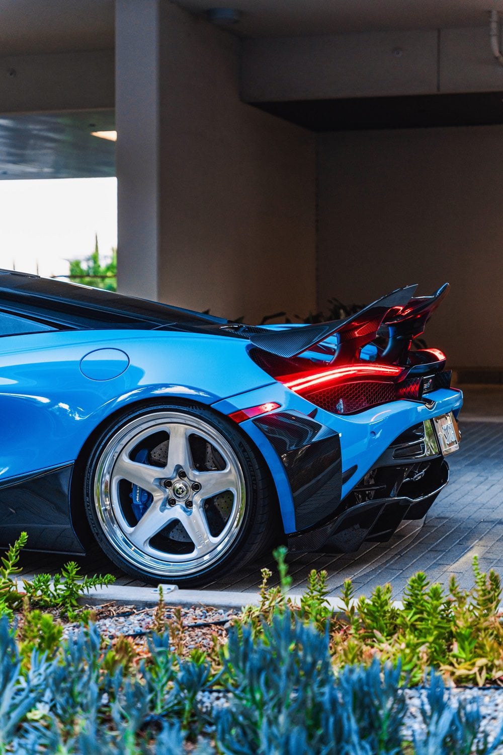 Blue McLaren 720S rear quarter with the V2 complete aero kit, close-up