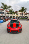 Red Porsche 911 GT2 RS head-on with carbon front lip