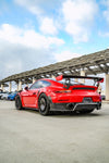 Red Porsche 911 GT2 RS rear view showing the rear diffuser and wing
