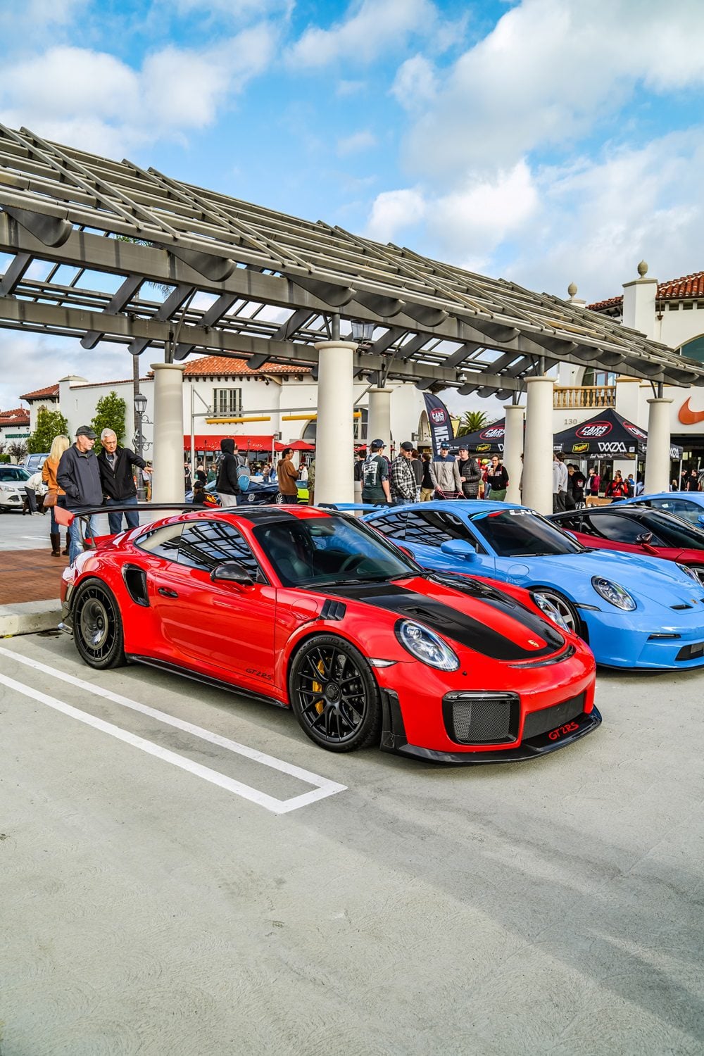 Red Porsche 911 GT2 RS front three-quarter at a car meet