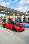 Red Porsche 911 GT2 RS front three-quarter at a car meet