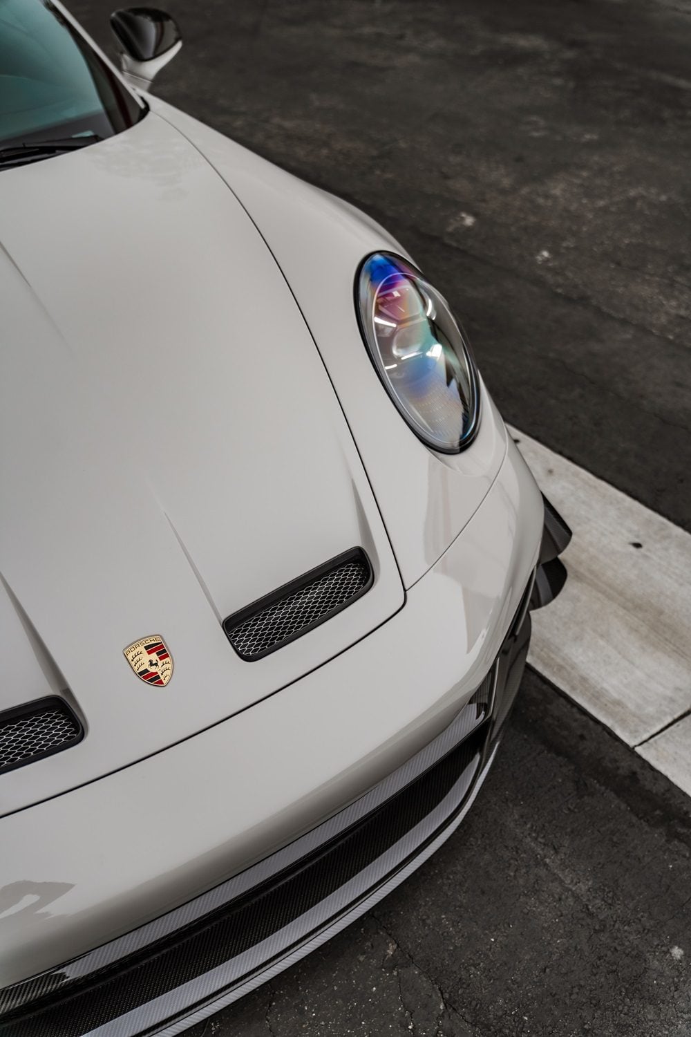 1016 vented hood on a white Porsche 911 GT3 (992), close-up
