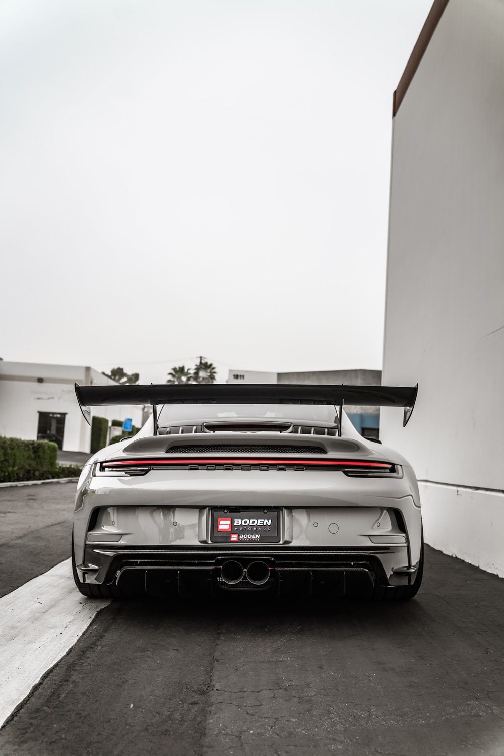 White Porsche 911 GT3 (992) straight rear view showing the lower rear diffuser