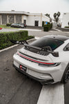 Grey Porsche 911 GT3 (992) overhead rear view with carbon wing blade