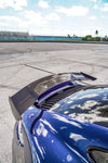 Carbon rear wing on a blue Porsche 911 Turbo S (992), close-up