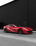 Red Ferrari 812 low front three-quarter showing side skirts