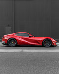 Red Ferrari 812 side profile showing carbon side skirts