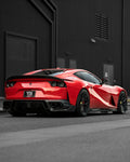 Red Ferrari 812 rear three-quarter showing the rear center diffuser