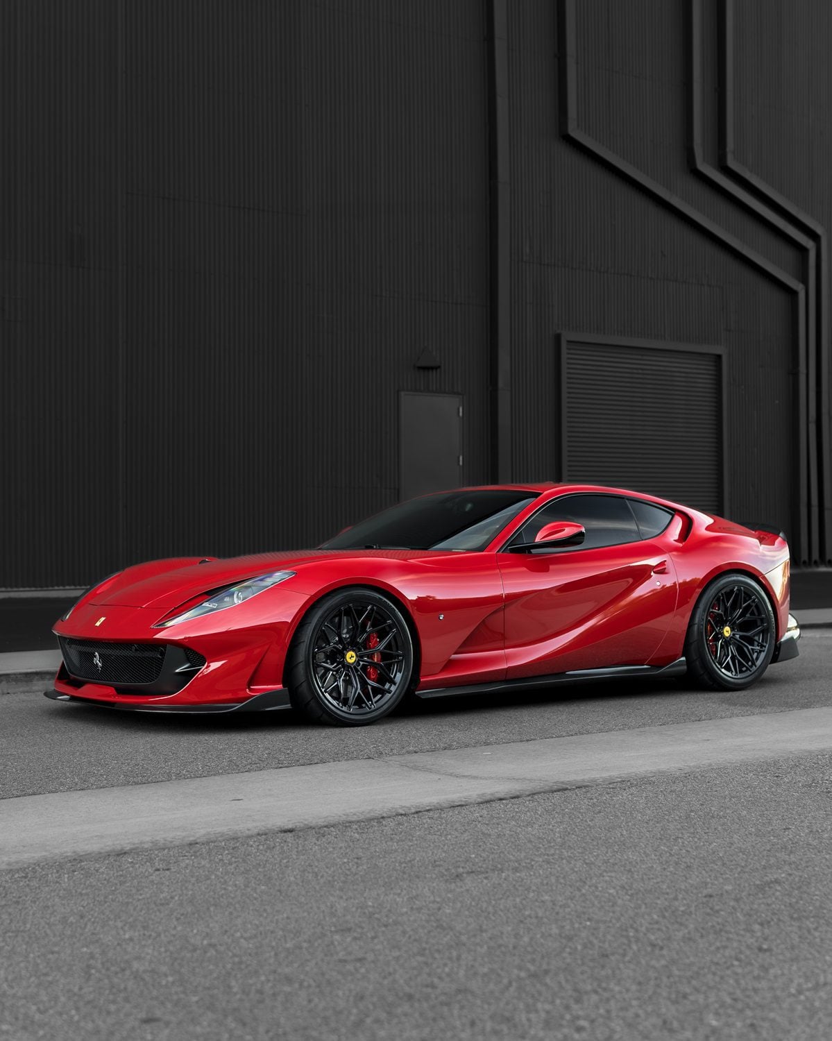 Red Ferrari 812 Superfast side profile with the complete aero kit