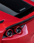 Carbon rear spoiler above the tail lights of a red Ferrari 812
