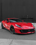 Red Ferrari 812 front three-quarter showing side skirts