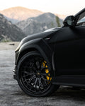 Matte black Lamborghini Urus Performante front fender with the complete aero kit, close-up