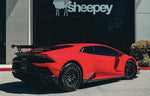 Red Lamborghini Huracan Evo rear three-quarter with carbon rear diffuser