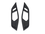 A front view of AUTOTECKNIC DRY CARBON INTERIOR DOOR HANDLE TRIM SET - BMW G22 4-SERIES 2020+ with white background