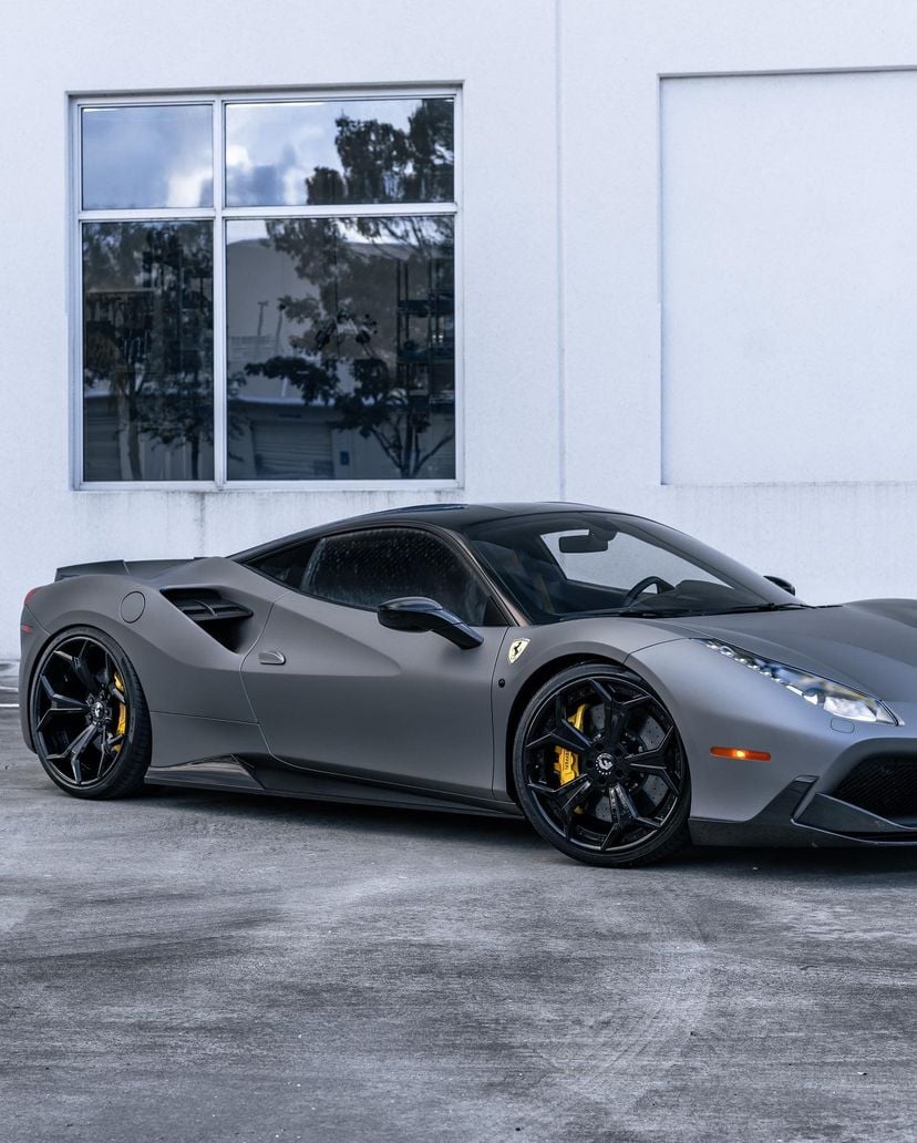 Grey Ferrari 488 side view showing carbon side intake vents