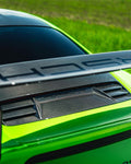 Carbon engine intake cover on a green Porsche 911 GT3 RS