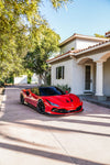 Red Ferrari F8 Tributo front three-quarter with carbon front aero lip