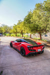 Red Ferrari F8 Tributo rear three-quarter with the complete aero kit