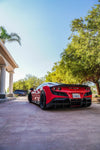 Red Ferrari F8 Tributo rear three-quarter showing the rear diffuser
