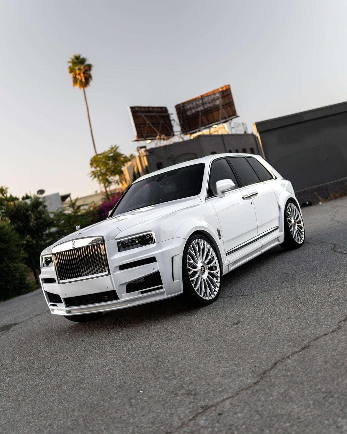 White Rolls-Royce Cullinan with the 1016 body kit, low front three-quarter