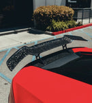 Forged carbon V1 tall rear wing on a red Lamborghini Huracan Evo, close-up