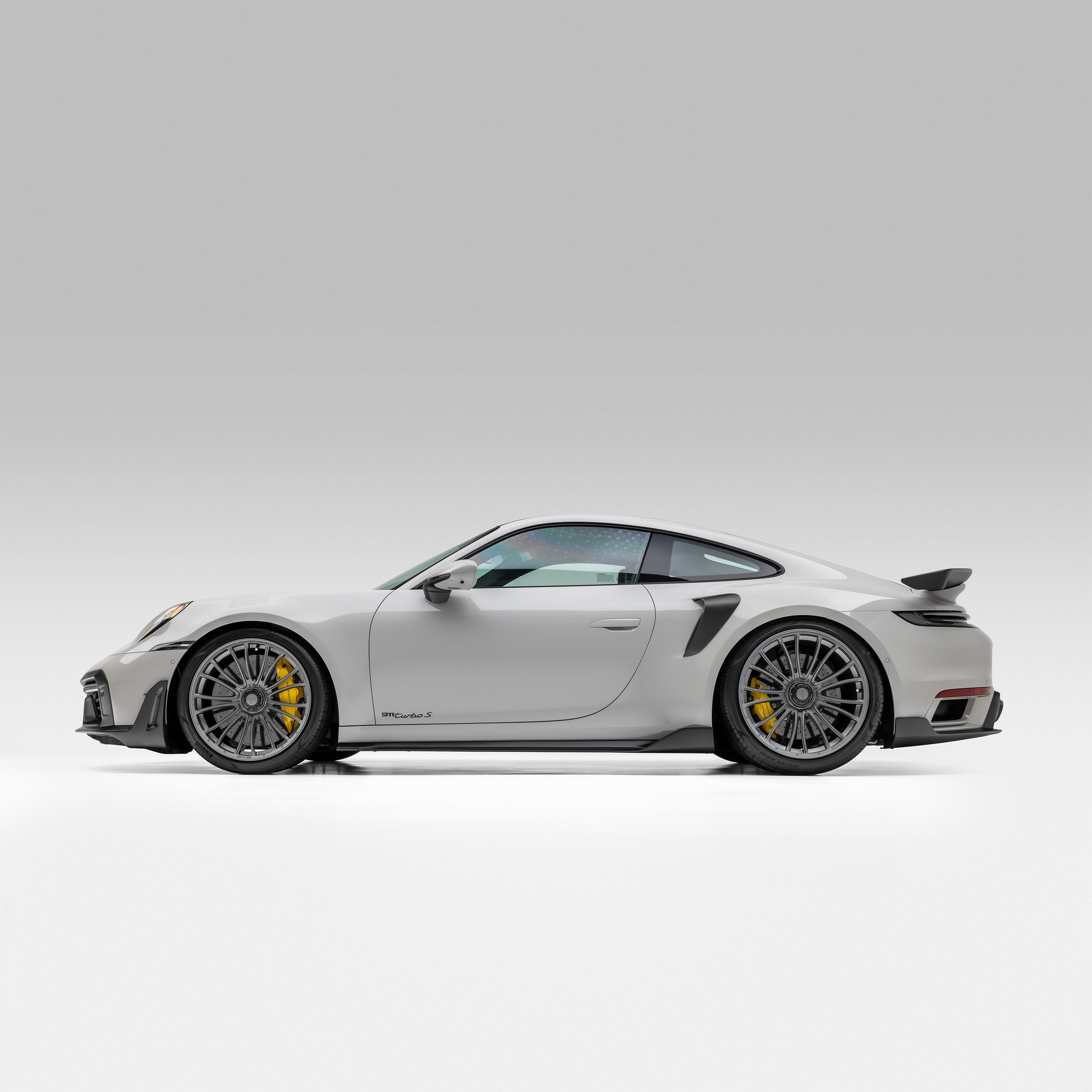 Porsche 992 Turbo S fitted with carbon rear wing, full side view