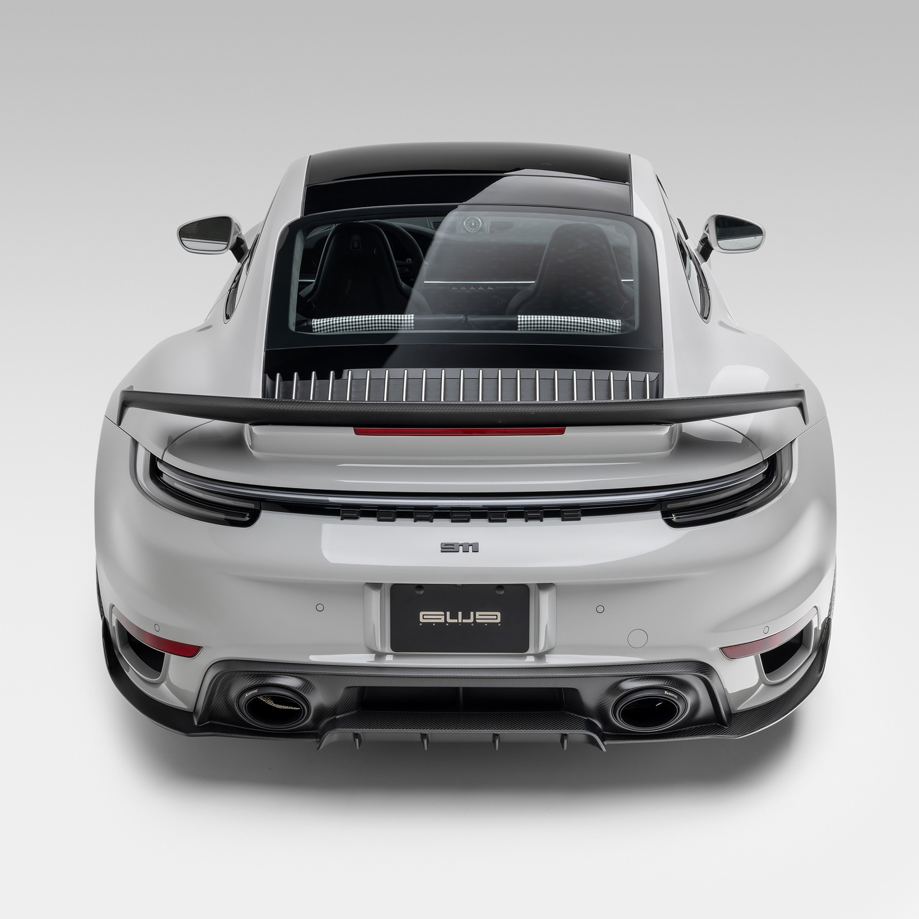 Silver 992 Turbo S with rear wing, overhead rear view