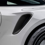 Carbon side intake trim on Porsche 992 Turbo S rear fender, close-up