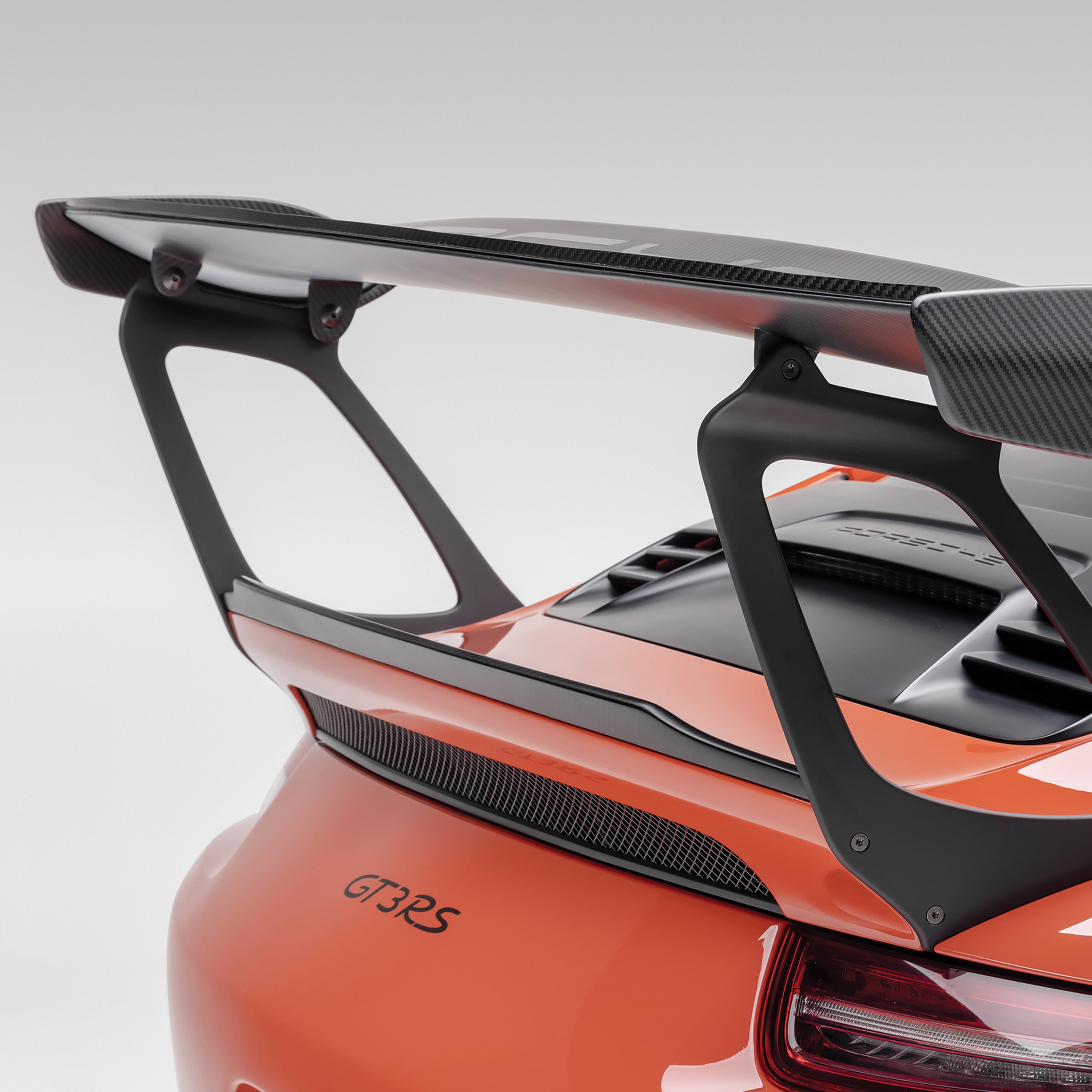 Orange GT3 RS rear deck with carbon decklid spoiler, rear 3/4 view
