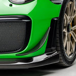 Carbon front canard on green Porsche 991.2 GT2 RS bumper, close-up