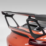 Orange GT3 RS wing with gurney flap, rear 3/4 view