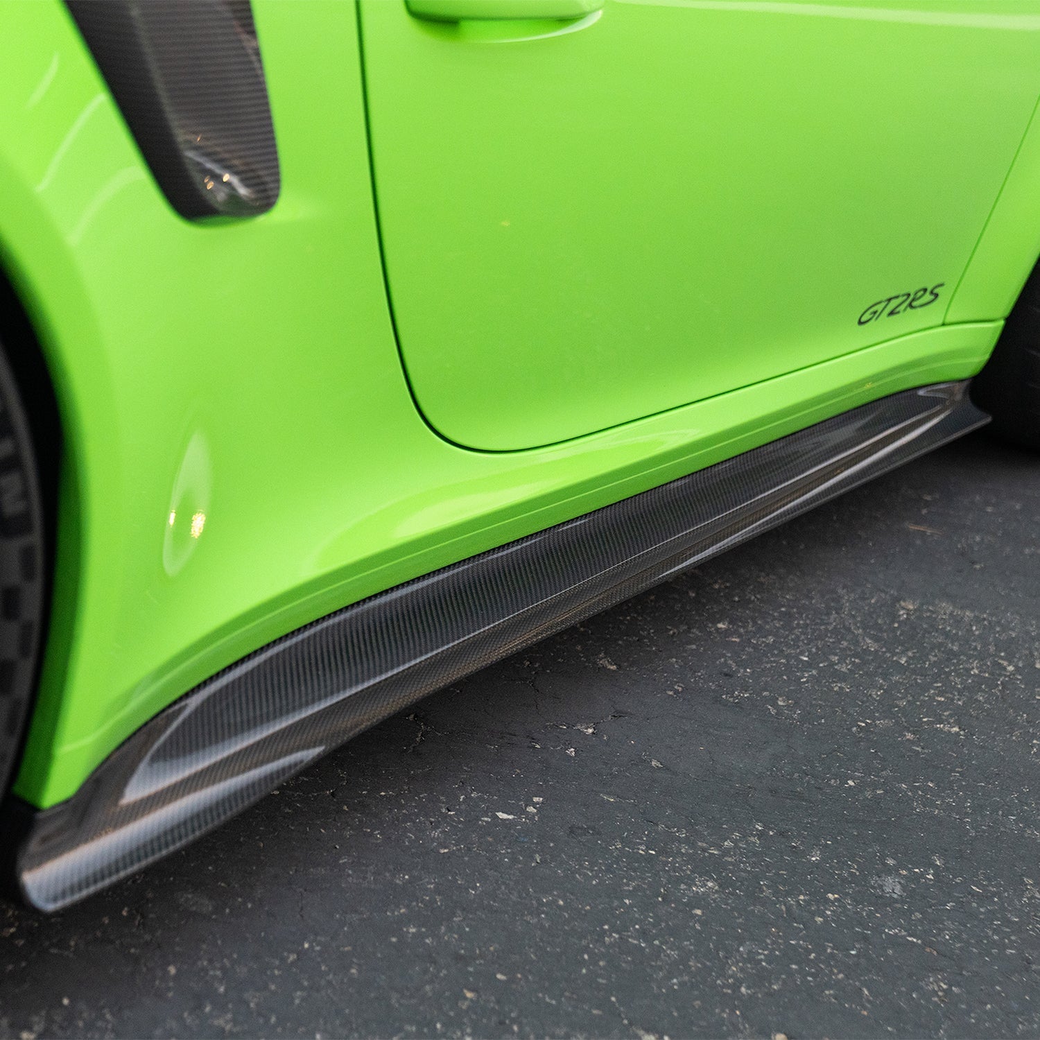 GT2 RS carbon rocker panel blade, rear-facing outdoor view