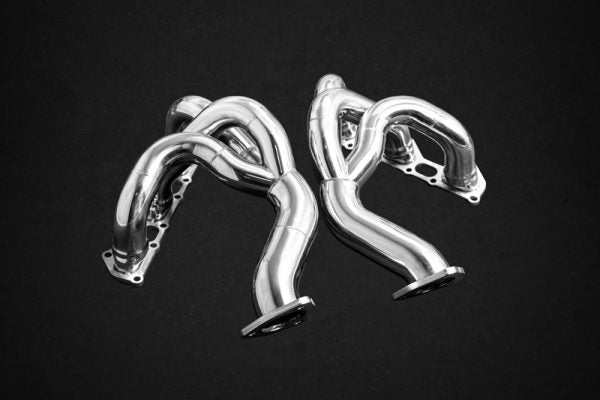 wide top view of Capristo Set: Header Manifolds and 100 Cell Sport Cats for Porsche 718 Spyder / GTS / Cayman GT4 2017+ with black background