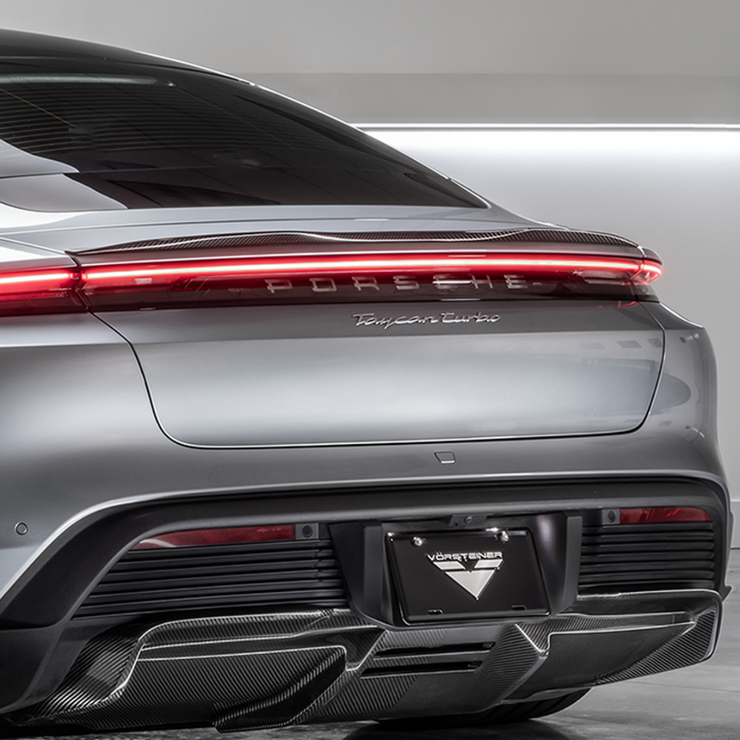 Silver Taycan Turbo with decklid spoiler, straight rear view