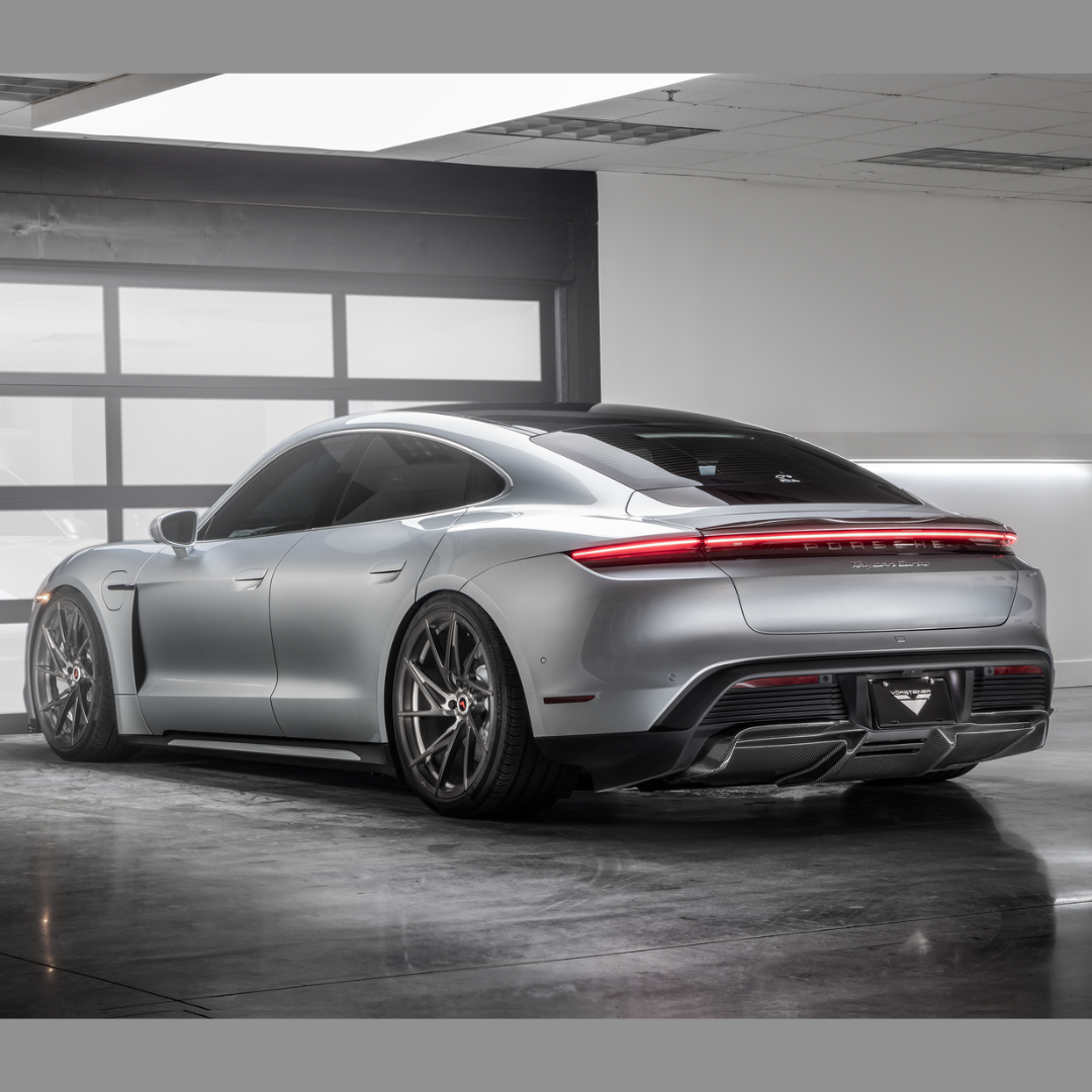 Taycan Turbo S with Vorsteiner decklid spoiler, garage rear 3/4 view