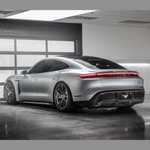 Taycan Turbo S with Vorsteiner decklid spoiler, garage rear 3/4 view