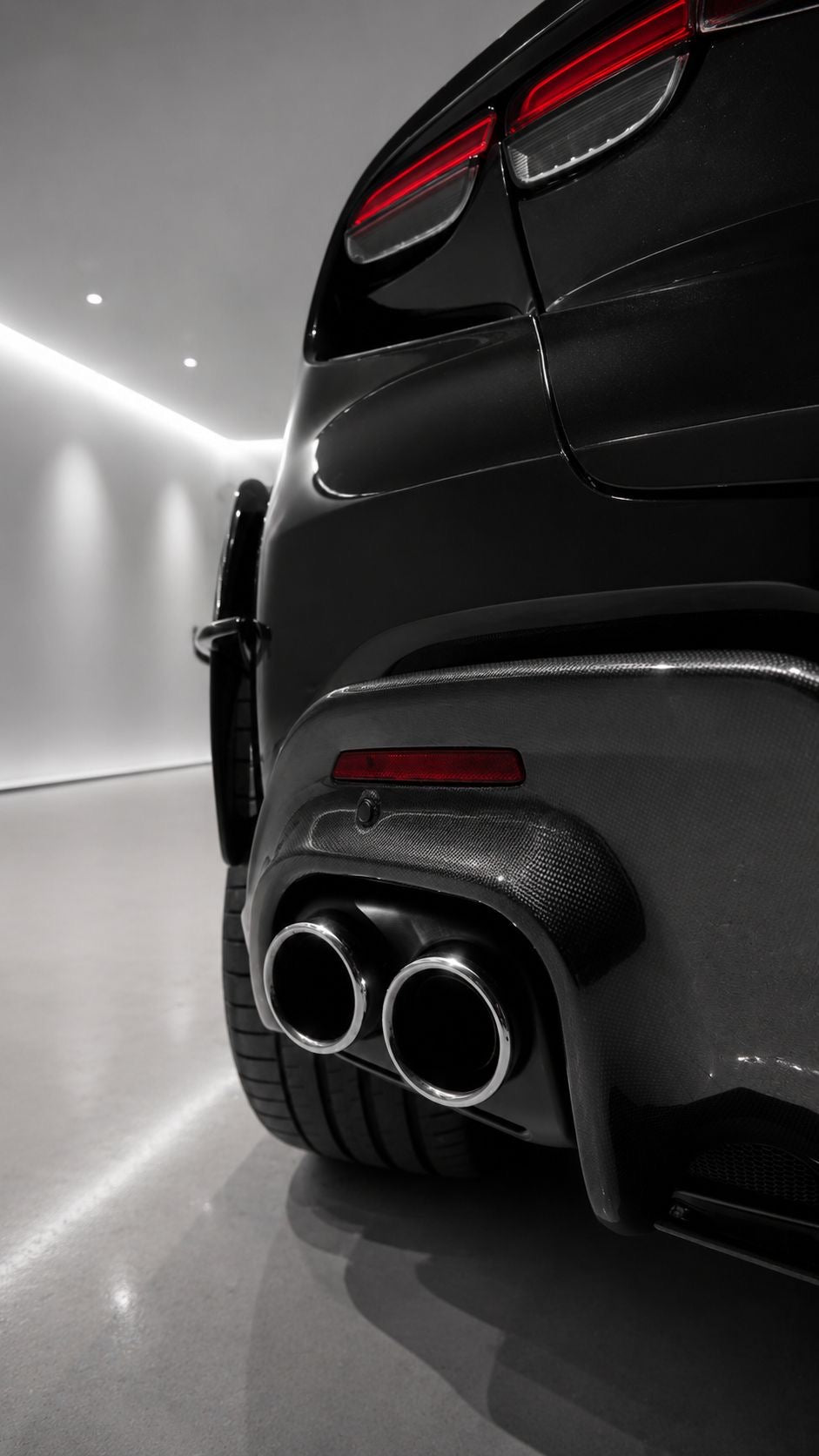 Capristo carbon rear diffuser around twin tailpipes on Ferrari Purosangue