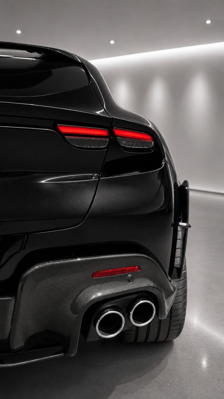 Rear quarter of Ferrari Purosangue showing Capristo carbon diffuser and tailpipes