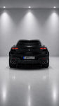 Black Ferrari Purosangue from behind with Capristo carbon fiber rear diffuser