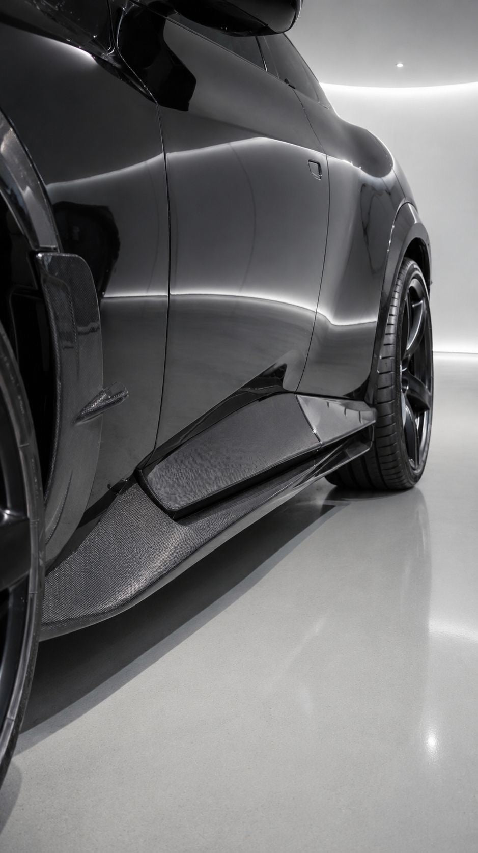 Close-up of Capristo carbon fiber side skirt on Ferrari Purosangue
