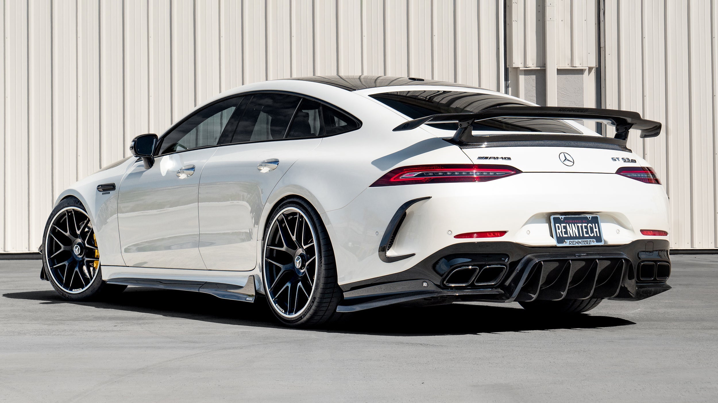 White AMG GT 4-Door car rear quarter with the A1 wing and diffuser - Carbon Fiber Aero Package for the 2019-2026 AMG GT 63 4-Door Coupe