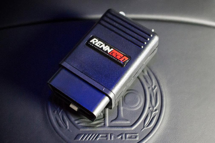 A top view of RENNtech | Hand-Held Suspension Module | Air Body Control | 2nd Gen Bluetooth enabled | for Mercedes with black background on mercedes amg emblem embedded on the background