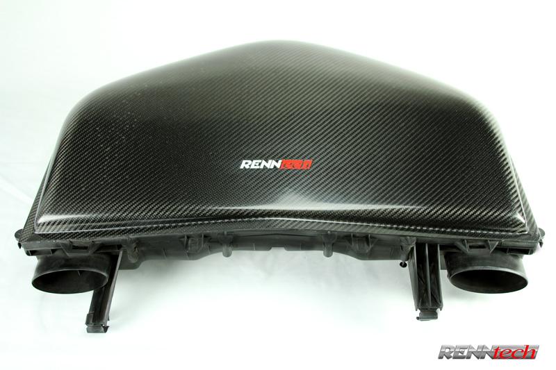 A close up view of RENNtech Carbon Fiber Bubble Top Airbox for V8 (M113 Engines) For Mercedes-Benz E 55 AMG 2003-2009 with white background