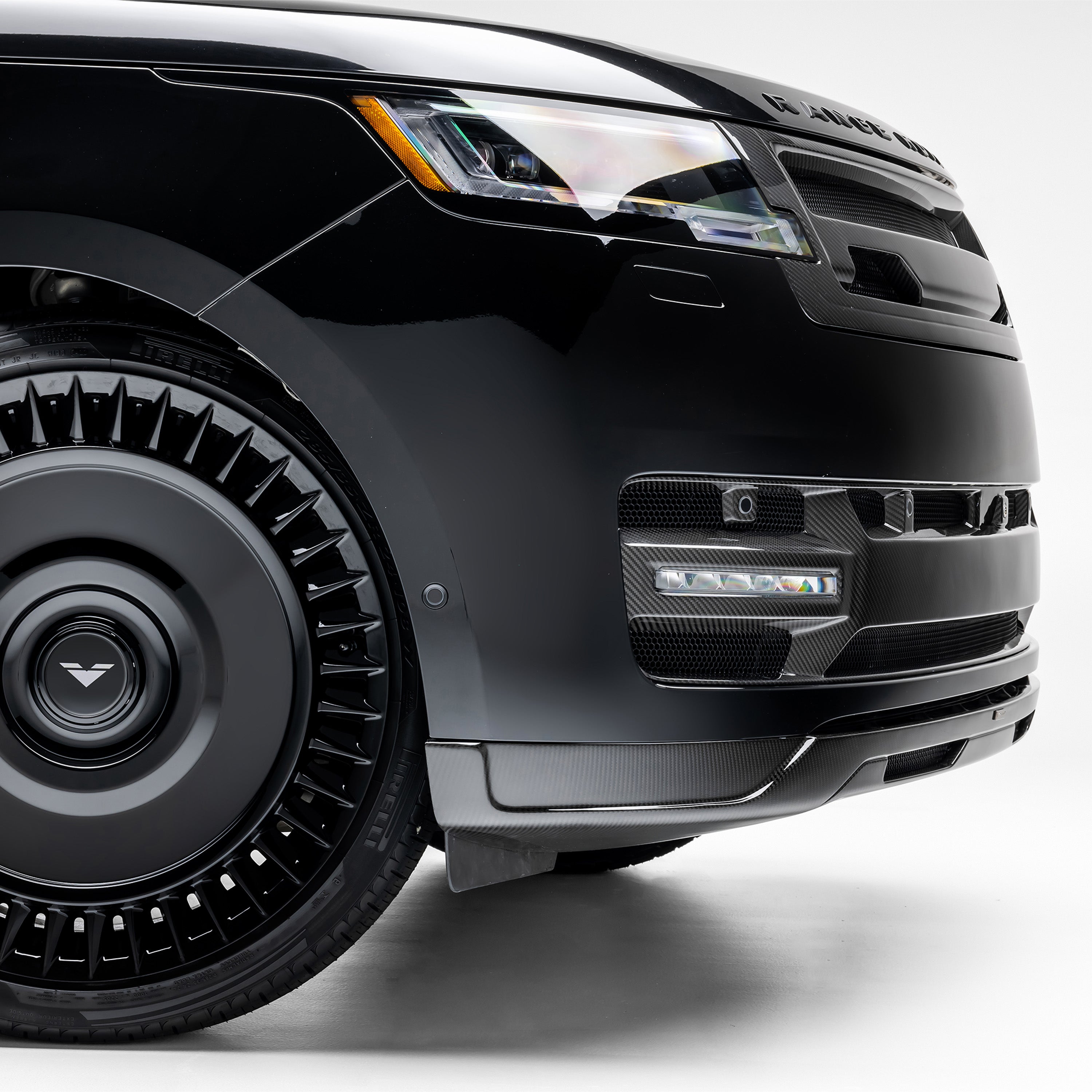 L460 front spoiler and wheel, low front corner view